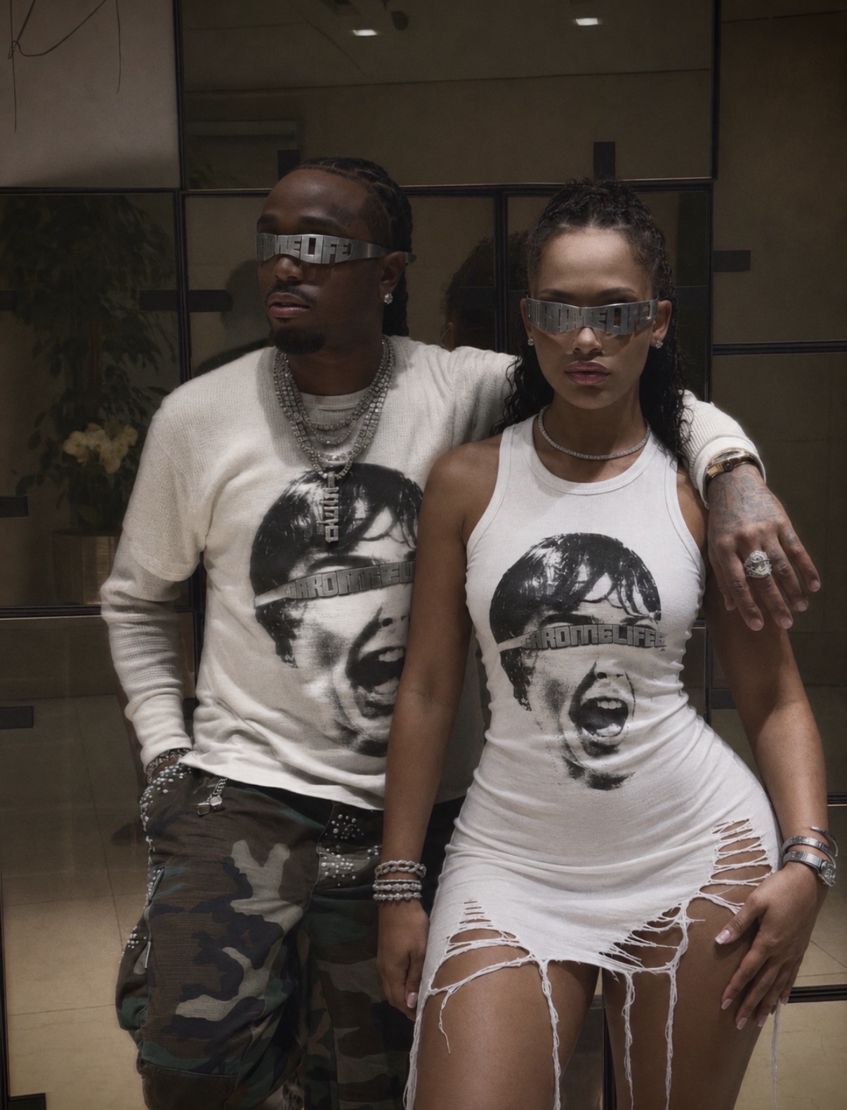 Quavo and a model wearing QRÖMELIFE fashion and chrome eyewear